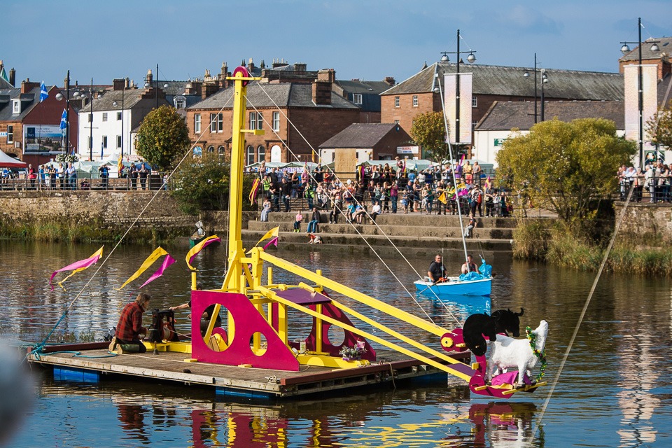 The dunking of the Salty Coo - Josh for the winning boat - with comely assistants Bill Barlow and Robbie Coleman